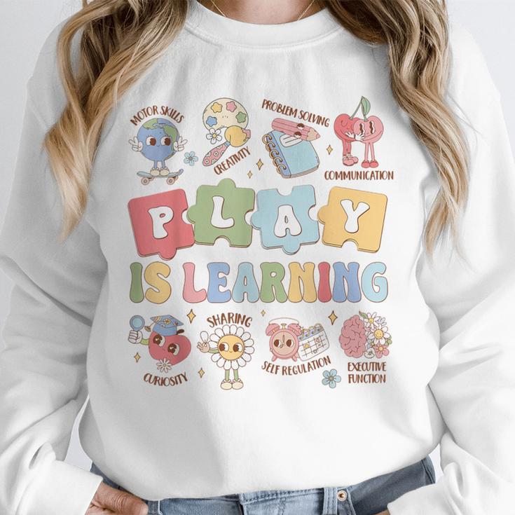 Teacher Groovy Play Is Learning Back To School Unisex Sweatshirt, novelty gifts, funny gifts