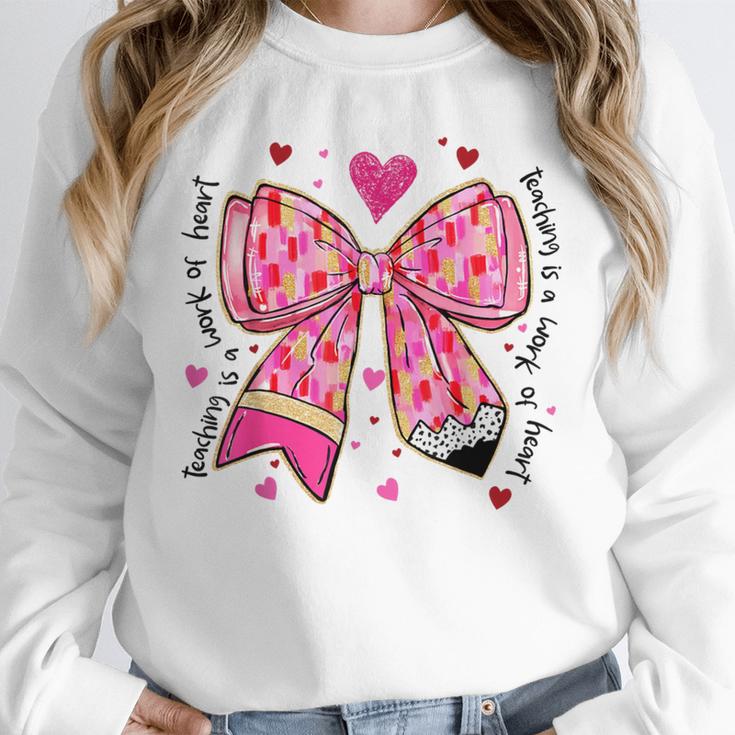 Teaching Is A Work Of Heart Pencil Bow Teacher Valentine Unisex Sweatshirt, novelty gifts, funny gifts Teaching Is A Work Of Heart Pencil Bow Teacher Valentine Unisex Sweatshirt, novelty gifts, funny gifts