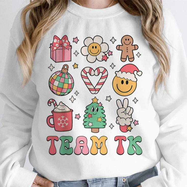 Team TK Teacher Christmas Groovy Smile Face Girl Boy Kid TK Unisex Sweatshirt, novelty gifts, funny gifts Team TK Teacher Christmas Groovy Smile Face Girl Boy Kid TK Unisex Sweatshirt, novelty gifts, funny gifts