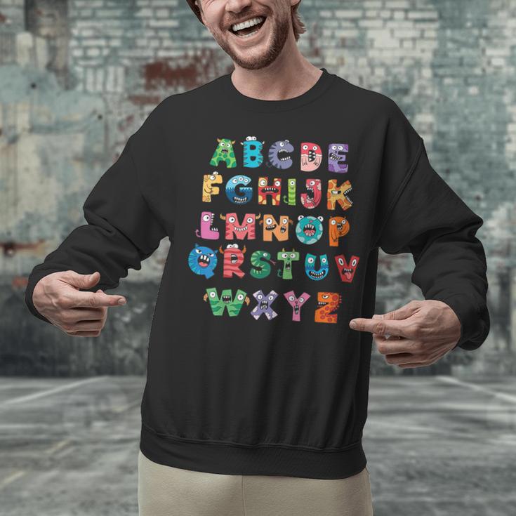 ABC Cute Monster Alphabet Halloween Teacher Costume Kids Unisex Sweatshirt, gift for family, gift for coworker ABC Cute Monster Alphabet Halloween Teacher Costume Kids Unisex Sweatshirt, gift for family, gift for coworker