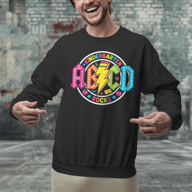 ABCD Kindergarten Rocks Back To School Teachers Students Unisex Sweatshirt, gift for family, gift for coworker ABCD Kindergarten Rocks Back To School Teachers Students Unisex Sweatshirt, gift for family, gift for coworker