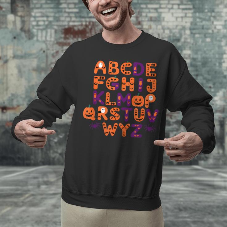 ABCs Learning Kindergarten Teacher Halloween Alphabet Unisex Sweatshirt, gift for family, gift for coworker ABCs Learning Kindergarten Teacher Halloween Alphabet Unisex Sweatshirt, gift for family, gift for coworker