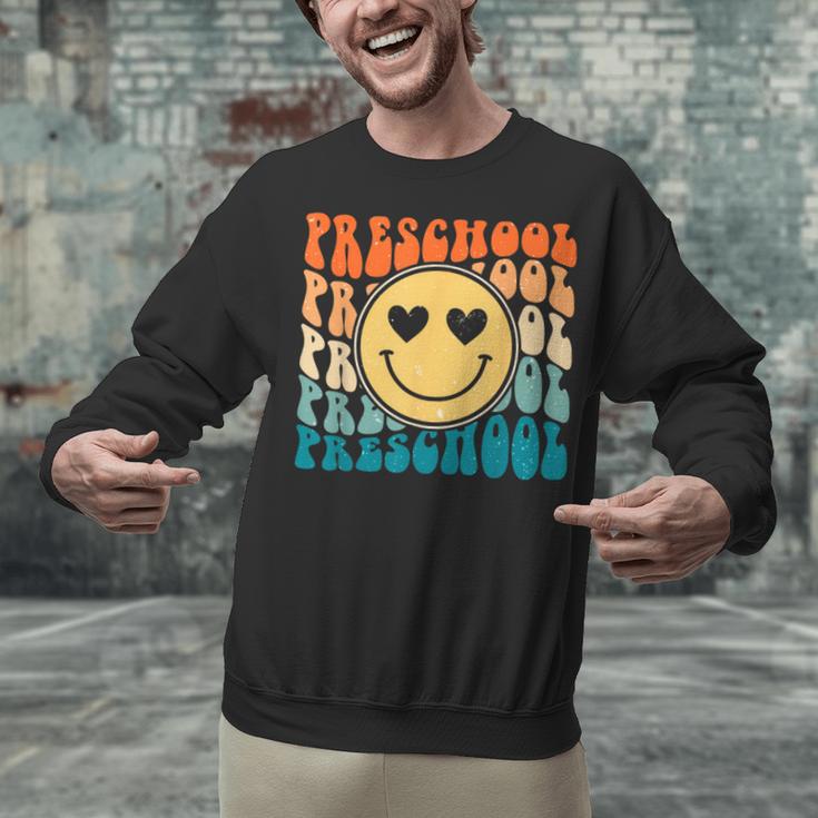 Back To School Groovy Smile Preschool Teachers Students Kids Unisex Sweatshirt, gift for family, gift for coworker