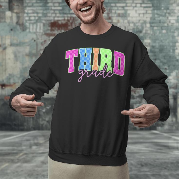 Back To School Neon Checkered Third Grade Colorful Teacher Unisex Sweatshirt, gift for family, gift for coworker Back To School Neon Checkered Third Grade Colorful Teacher Unisex Sweatshirt, gift for family, gift for coworker