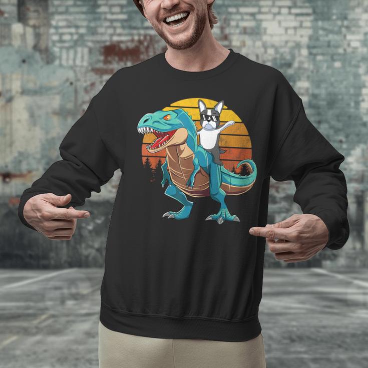 Boston Terrier Dog Riding Dinosaur T Rex Boys Unisex Sweatshirt, Boston Terrier Riding Sweatshirts, gift for family, gift for coworker