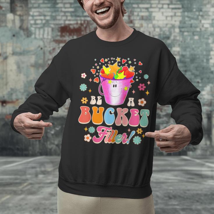 Be A Bucket Filler Teacher Teaching Groovy Back To School For Men Women Unisex Sweatshirt, Groovy Teacher Sweatshirts, gift for family, gift for coworker Be A Bucket Filler Teacher Teaching Groovy Back To School For Men Women Unisex Sweatshirt, Groovy Teacher Sweatshirts, gift for family, gift for coworker