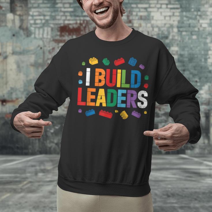 I Build Leaders Bricks Building Blocks Teacher Brick Builder Unisex Sweatshirt, gift for family, gift for coworker