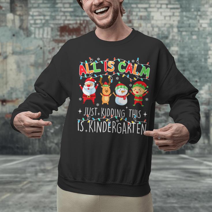 All Is Calm Xmas Kindergarten Christmas Season Teacher Unisex Sweatshirt, gift for family, gift for coworker All Is Calm Xmas Kindergarten Christmas Season Teacher Unisex Sweatshirt, gift for family, gift for coworker
