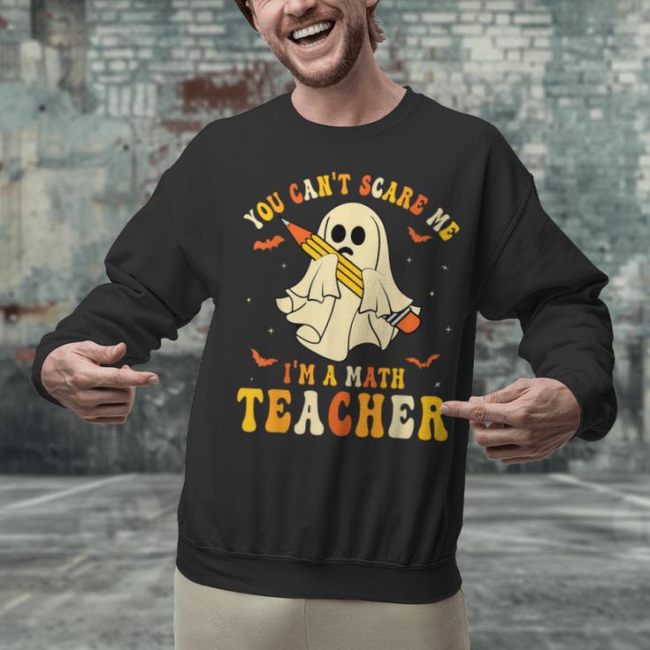 You Can't Scare Me I'm A Math Teacher Halloween Ghost Groovy Unisex Sweatshirt, Groovy Teacher Sweatshirts, gift for family, gift for coworker You Can't Scare Me I'm A Math Teacher Halloween Ghost Groovy Unisex Sweatshirt, Groovy Teacher Sweatshirts, gift for family, gift for coworker