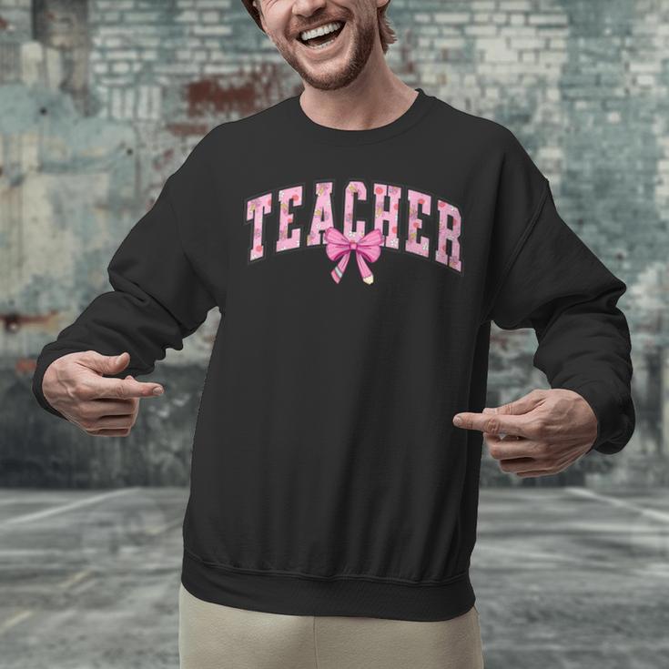 Coquette Bow Back To School First Day Teacher Unisex Sweatshirt, gift for family, gift for coworker Coquette Bow Back To School First Day Teacher Unisex Sweatshirt, gift for family, gift for coworker
