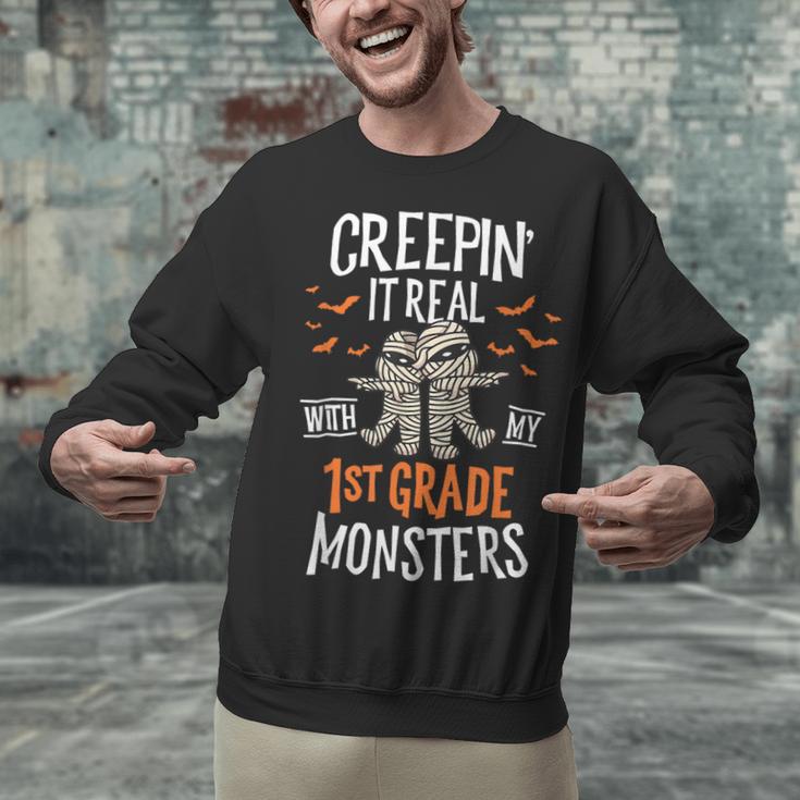 Creepin It Real With My 1st Grade Monsters Halloween Teacher Unisex Sweatshirt, gift for family, gift for coworker Creepin It Real With My 1st Grade Monsters Halloween Teacher Unisex Sweatshirt, gift for family, gift for coworker