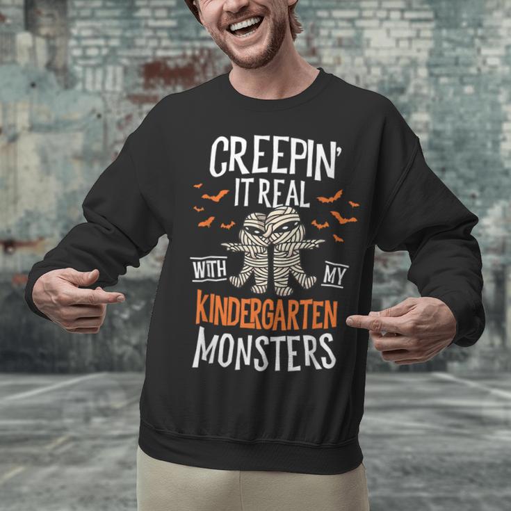 Creepin It Real Kindergarten Monsters Halloween Teacher Unisex Sweatshirt, gift for family, gift for coworker
