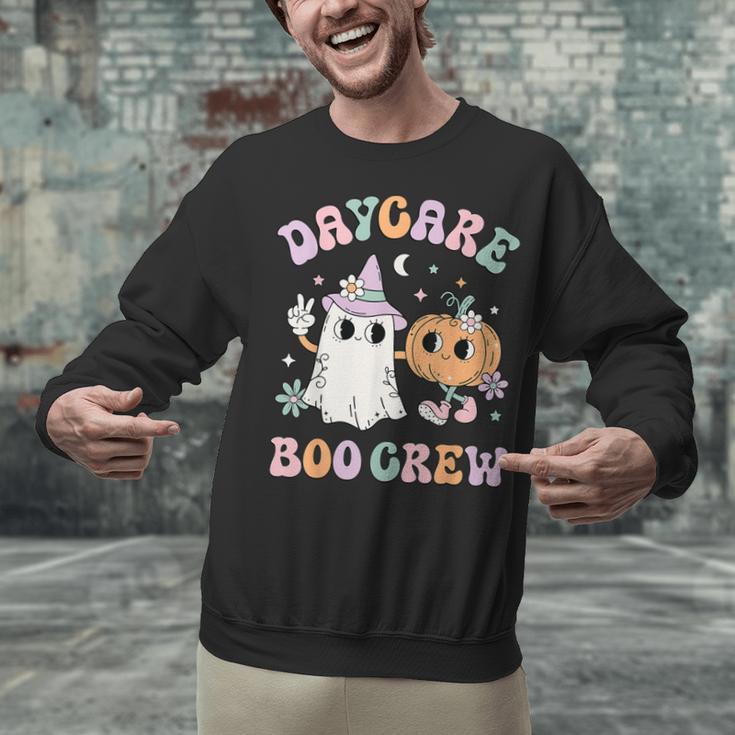 Daycare Boo Crew Groovy Halloween Floral Ghost Kid Teacher Unisex Sweatshirt, Groovy Teacher Sweatshirts, gift for family, gift for coworker