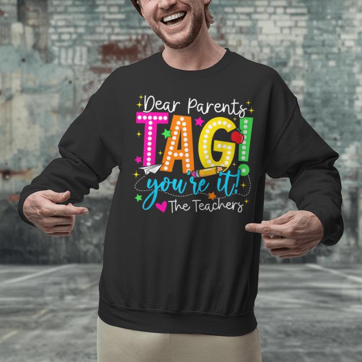 Dear Parents Tag You'Re It Love Teachers Last Day Of School Unisex Sweatshirt, gift for family, gift for coworker Dear Parents Tag You'Re It Love Teachers Last Day Of School Unisex Sweatshirt, gift for family, gift for coworker