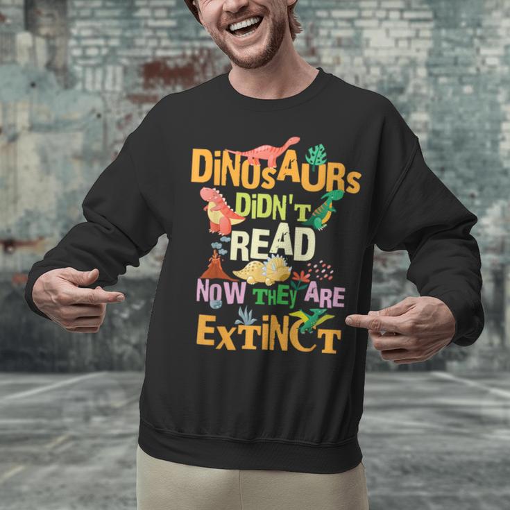 Dinosaurs Didn't Read Now They Are Extinct Reading Teacher Unisex Sweatshirt, gift for family, gift for coworker Dinosaurs Didn't Read Now They Are Extinct Reading Teacher Unisex Sweatshirt, gift for family, gift for coworker
