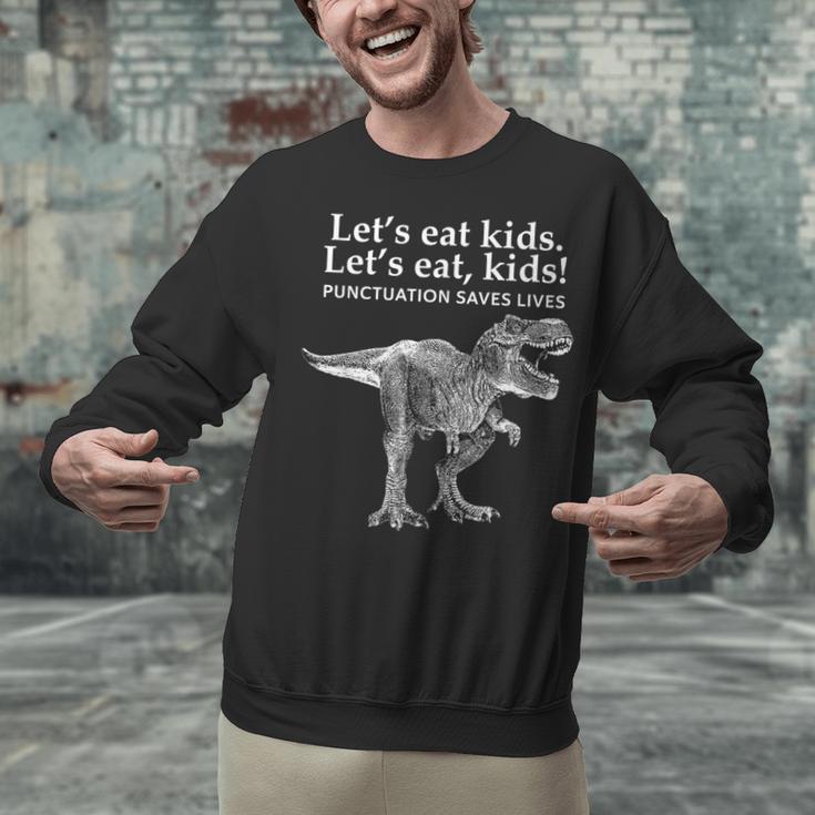Lets Eat Kids Punctuation Saves Lives Dinosaur Teacher Unisex Sweatshirt, gift for family, gift for coworker