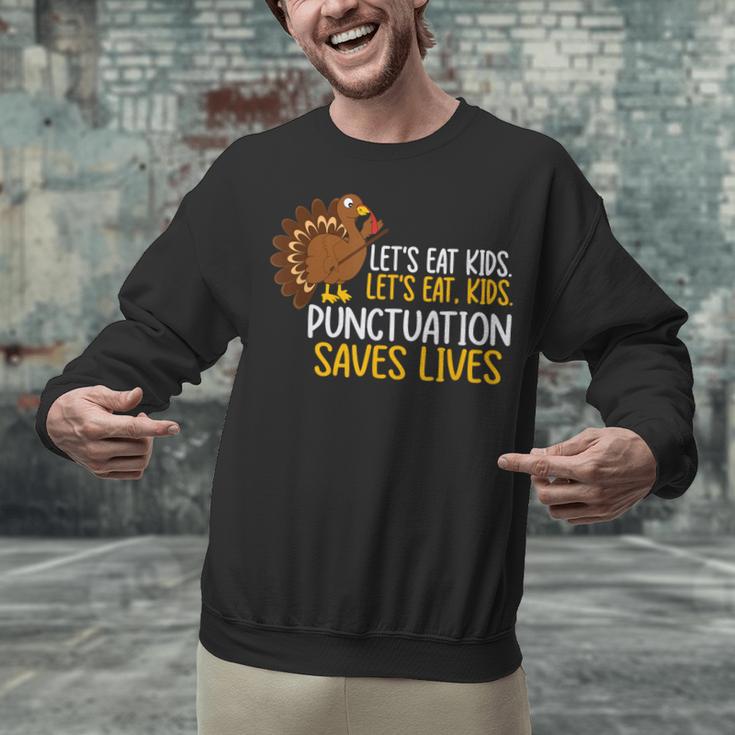 Lets Eat Kids Punctuation Turkey Thanksgiving Teacher Unisex Sweatshirt, gift for family, gift for coworker Lets Eat Kids Punctuation Turkey Thanksgiving Teacher Unisex Sweatshirt, gift for family, gift for coworker