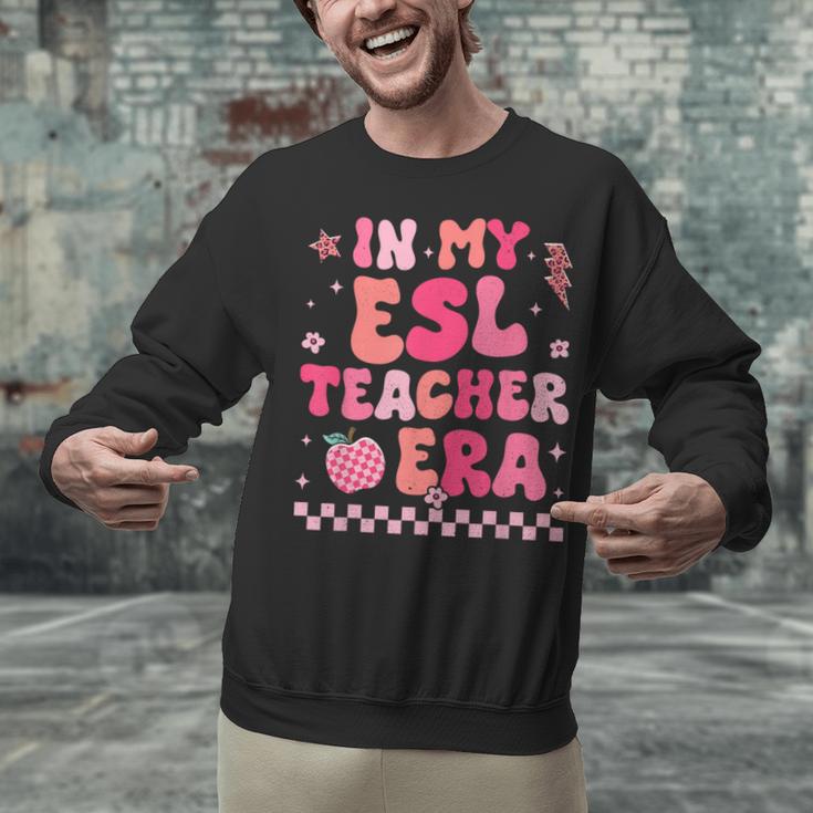 In My Esl Teacher Era Back To School ESL Teacher Groovy Unisex Sweatshirt, Esl Teacher Sweatshirts, Groovy Teacher Sweatshirts, gift for family, gift for coworker In My Esl Teacher Era Back To School ESL Teacher Groovy Unisex Sweatshirt, Esl Teacher Sweatshirts, Groovy Teacher Sweatshirts, gift for family, gift for coworker
