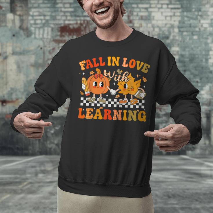 Fall In Love With Learning Autumn Pumpkin Fall Teacher Kids Unisex Sweatshirt, gift for family, gift for coworker Fall In Love With Learning Autumn Pumpkin Fall Teacher Kids Unisex Sweatshirt, gift for family, gift for coworker