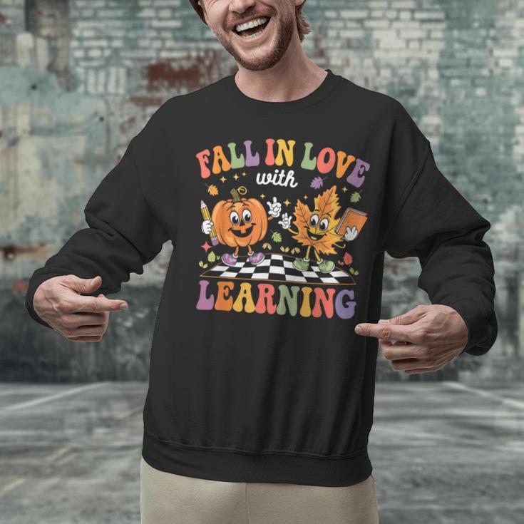 Fall In Love With Learning Autumn Fall Season Teacher Unisex Sweatshirt, gift for family, gift for coworker Fall In Love With Learning Autumn Fall Season Teacher Unisex Sweatshirt, gift for family, gift for coworker