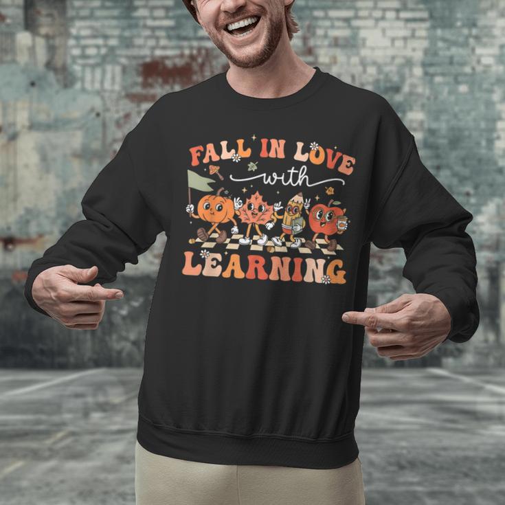 Fall In Love With Learning Autumn Teacher Thanksgiving Unisex Sweatshirt, gift for family, gift for coworker Fall In Love With Learning Autumn Teacher Thanksgiving Unisex Sweatshirt, gift for family, gift for coworker