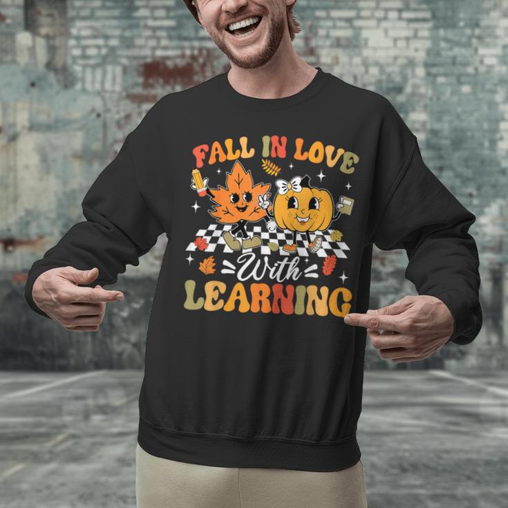 Fall In Love With Learning Fall Teacher Thanksgiving Retro Unisex Sweatshirt, gift for family, gift for coworker Fall In Love With Learning Fall Teacher Thanksgiving Retro Unisex Sweatshirt, gift for family, gift for coworker