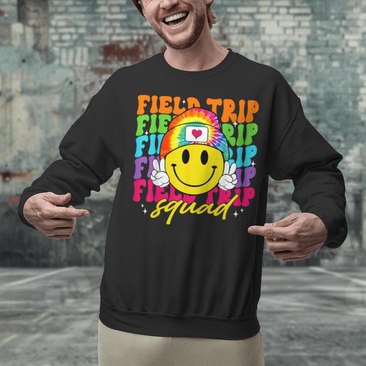 Field Trip Squad Groovy Field Day Smile Face Teacher Tie Dye Unisex Sweatshirt, Groovy Teacher Sweatshirts, gift for family, gift for coworker Field Trip Squad Groovy Field Day Smile Face Teacher Tie Dye Unisex Sweatshirt, Groovy Teacher Sweatshirts, gift for family, gift for coworker