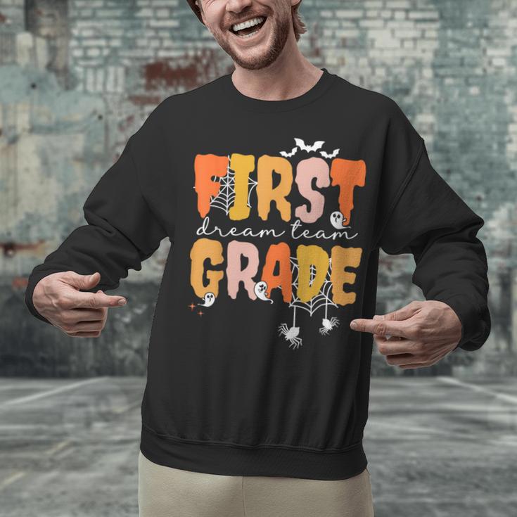 First Grade Dream Retro Team Fall Halloween Spooky Teachers Unisex Sweatshirt, First Grade Teacher Sweatshirts, gift for family, gift for coworker First Grade Dream Retro Team Fall Halloween Spooky Teachers Unisex Sweatshirt, First Grade Teacher Sweatshirts, gift for family, gift for coworker