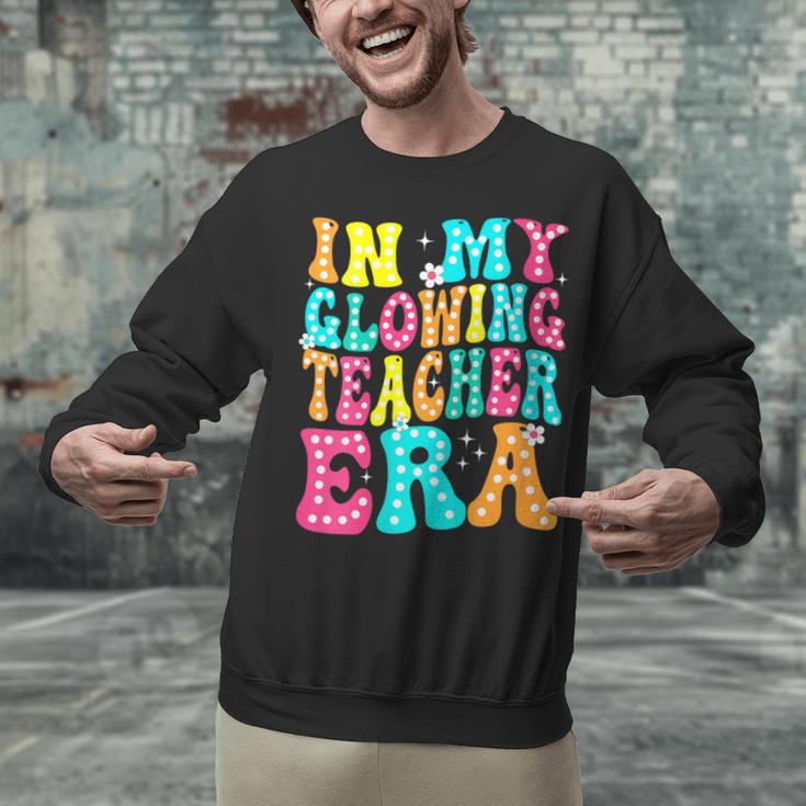 In My Glowing Teacher Era Groovy Colorful Bright Unisex Sweatshirt, Groovy Teacher Sweatshirts, gift for family, gift for coworker In My Glowing Teacher Era Groovy Colorful Bright Unisex Sweatshirt, Groovy Teacher Sweatshirts, gift for family, gift for coworker