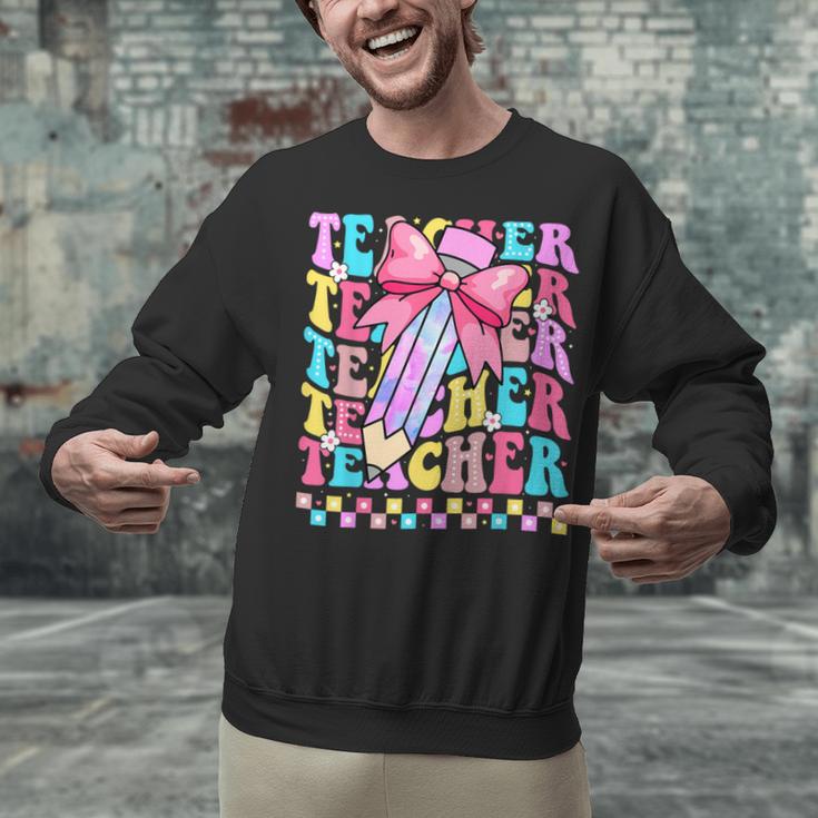 Groovy Teacher Cute Coquette Bow Flower Retro Back To School Unisex Sweatshirt, Groovy Teacher Sweatshirts, gift for family, gift for coworker Groovy Teacher Cute Coquette Bow Flower Retro Back To School Unisex Sweatshirt, Groovy Teacher Sweatshirts, gift for family, gift for coworker