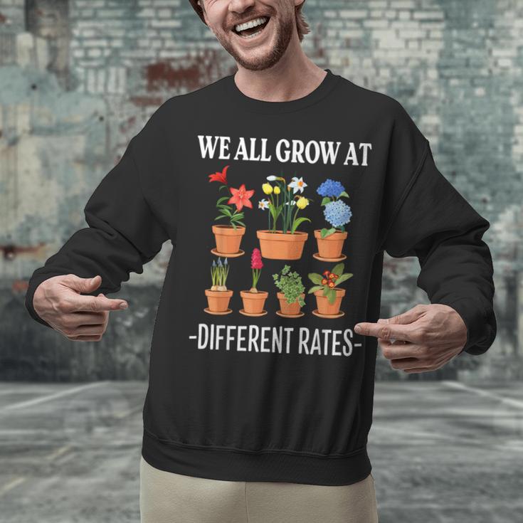 We All Grow At Different Rates Back To School Teacher Unisex Sweatshirt, gift for family, gift for coworker We All Grow At Different Rates Back To School Teacher Unisex Sweatshirt, gift for family, gift for coworker