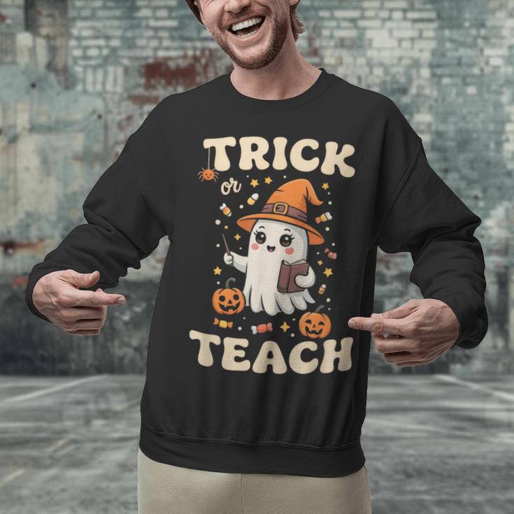 Halloween Teacher Shirts Women School Trick Or Teach Groovy Unisex Sweatshirt, Groovy Teacher Sweatshirts, gift for family, gift for coworker Halloween Teacher Shirts Women School Trick Or Teach Groovy Unisex Sweatshirt, Groovy Teacher Sweatshirts, gift for family, gift for coworker