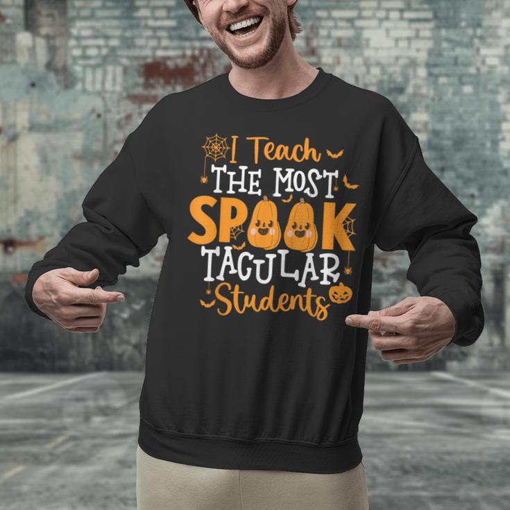 Halloween Teacher I Teach The Most Spooktacular Students Men Women Unisex Sweatshirt, gift for family, gift for coworker Halloween Teacher I Teach The Most Spooktacular Students Men Women Unisex Sweatshirt, gift for family, gift for coworker