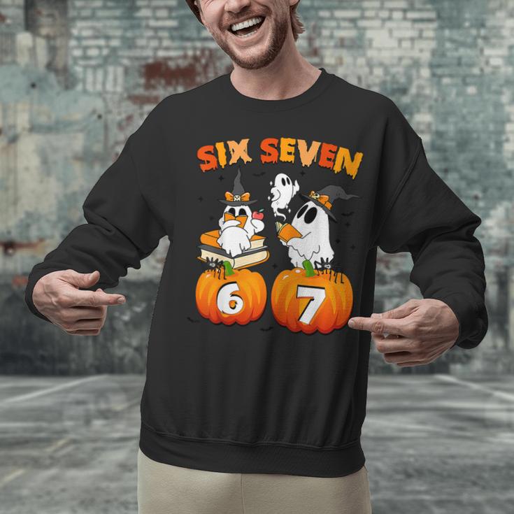 Haunted By 67 Boo Ghost Pumpkin Halloween Teacher Unisex Sweatshirt, gift for family, gift for coworker Haunted By 67 Boo Ghost Pumpkin Halloween Teacher Unisex Sweatshirt, gift for family, gift for coworker