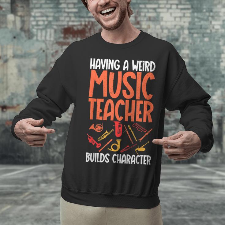 Having a Weird Music Teacher Builds Character Music Teacher Unisex Sweatshirt, gift for family, gift for coworker Having a Weird Music Teacher Builds Character Music Teacher Unisex Sweatshirt, gift for family, gift for coworker