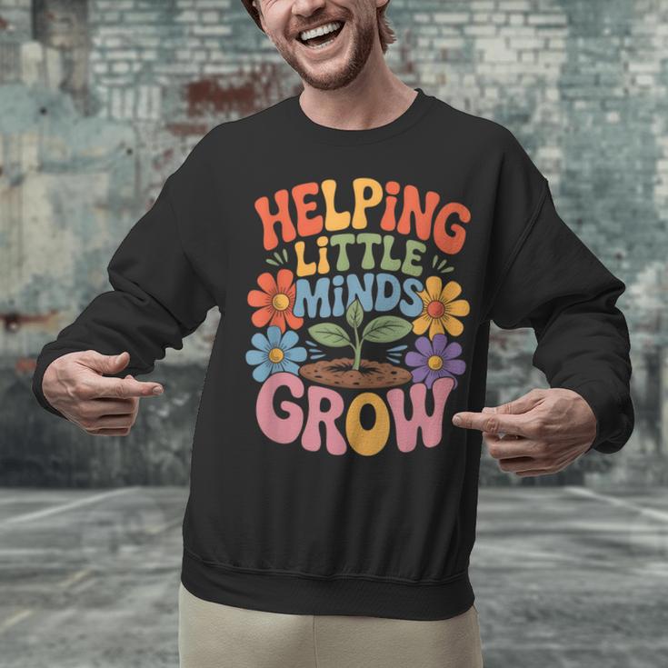Helping Little Minds Grow Teacher First Day Back To School Unisex Sweatshirt, gift for family, gift for coworker Helping Little Minds Grow Teacher First Day Back To School Unisex Sweatshirt, gift for family, gift for coworker