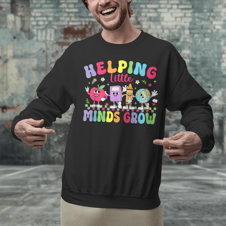Helping Little Minds Grow Teacher Life Back To School Unisex Sweatshirt, gift for family, gift for coworker
