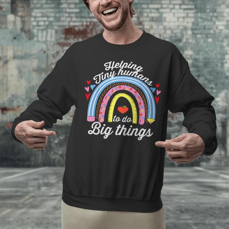 Helping Tiny Humans To Do Big Things Teacher Women Unisex Sweatshirt, gift for family, gift for coworker Helping Tiny Humans To Do Big Things Teacher Women Unisex Sweatshirt, gift for family, gift for coworker