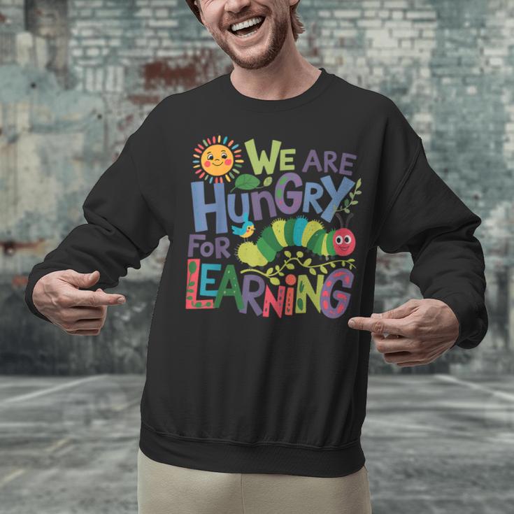 We Are Hungry For Learning Teacher Life Back To School Unisex Sweatshirt, gift for family, gift for coworker We Are Hungry For Learning Teacher Life Back To School Unisex Sweatshirt, gift for family, gift for coworker
