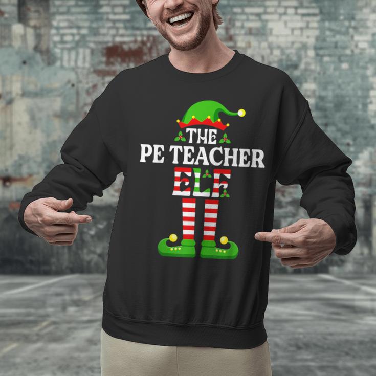 I'm The PE Teacher Elf Christmas Family Matching Unisex Sweatshirt, Pe Teacher Sweatshirts, gift for family, gift for coworker I'm The PE Teacher Elf Christmas Family Matching Unisex Sweatshirt, Pe Teacher Sweatshirts, gift for family, gift for coworker