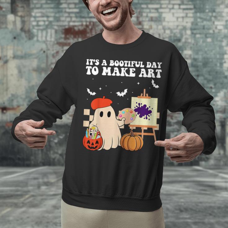 It's A Bootiful Day To Make Art Groovy Art Teacher Halloween Unisex Sweatshirt, Groovy Teacher Sweatshirts, gift for family, gift for coworker It's A Bootiful Day To Make Art Groovy Art Teacher Halloween Unisex Sweatshirt, Groovy Teacher Sweatshirts, gift for family, gift for coworker