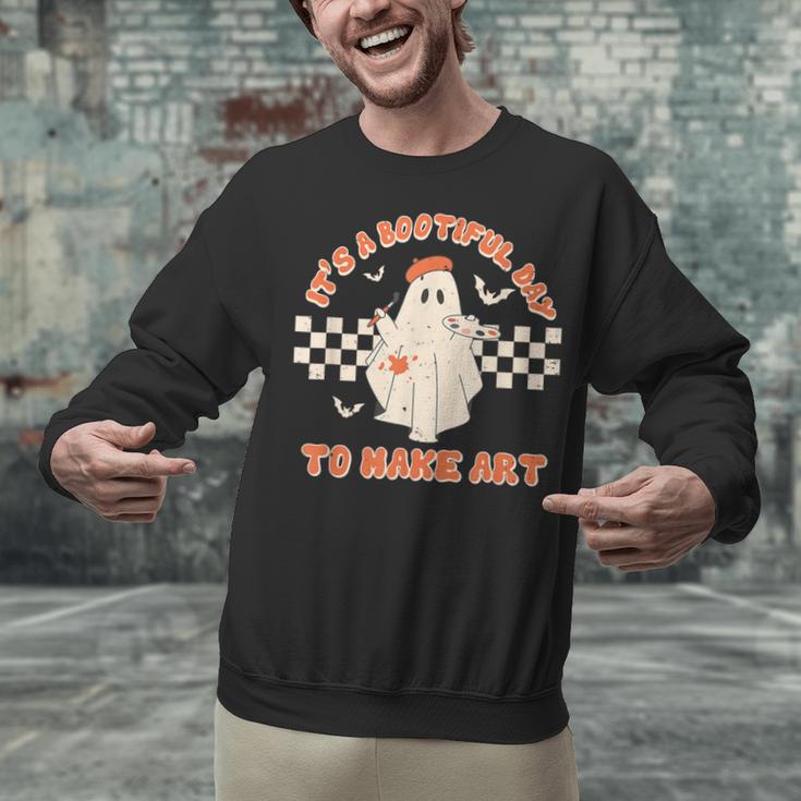 It's A Bootiful Day To Make Art Halloween Art Teacher Unisex Sweatshirt, gift for family, gift for coworker It's A Bootiful Day To Make Art Halloween Art Teacher Unisex Sweatshirt, gift for family, gift for coworker