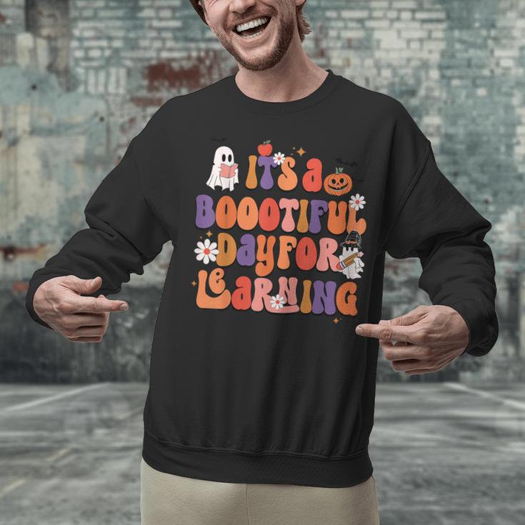 It's A Bootiful Day For Learning Cute Teacher Halloween Unisex Sweatshirt, gift for family, gift for coworker It's A Bootiful Day For Learning Cute Teacher Halloween Unisex Sweatshirt, gift for family, gift for coworker
