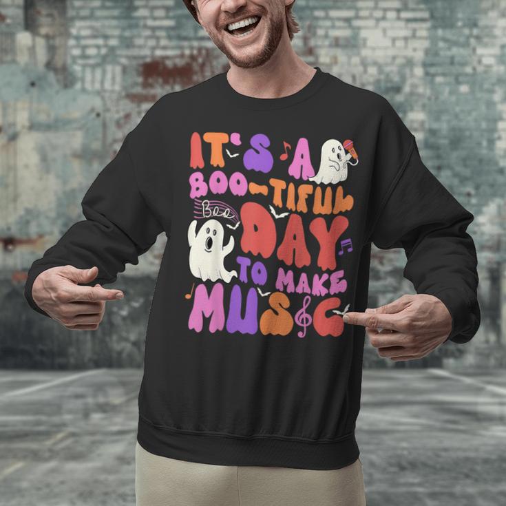 It's a Bootiful Day To Make Music Halloween Music Teacher Unisex Sweatshirt, gift for family, gift for coworker It's a Bootiful Day To Make Music Halloween Music Teacher Unisex Sweatshirt, gift for family, gift for coworker