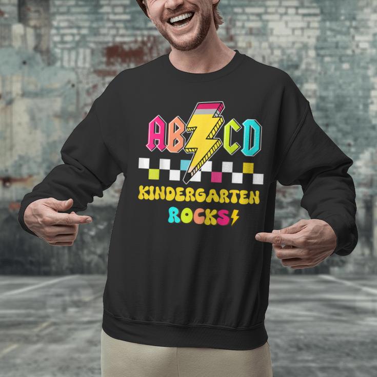 Kindergarten ABCD Rocks Teacher Student Back To School Unisex Sweatshirt, gift for family, gift for coworker Kindergarten ABCD Rocks Teacher Student Back To School Unisex Sweatshirt, gift for family, gift for coworker