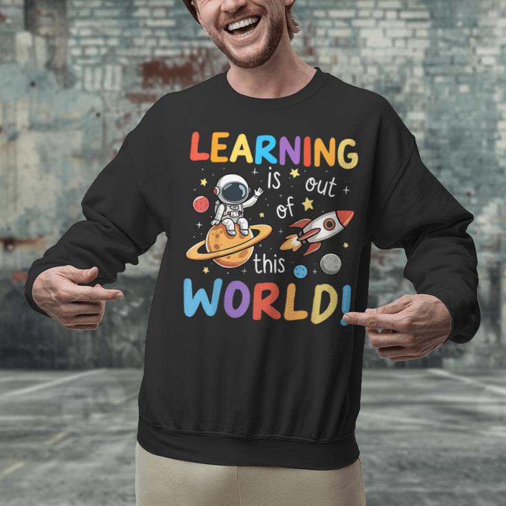 Learning Is Out Of This World Space Back To School Teacher Unisex Sweatshirt, gift for family, gift for coworker Learning Is Out Of This World Space Back To School Teacher Unisex Sweatshirt, gift for family, gift for coworker