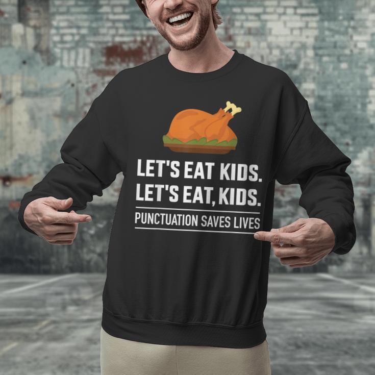 Let's Eat Kids Grammar For Thanksgiving Teacher Unisex Sweatshirt, gift for family, gift for coworker Let's Eat Kids Grammar For Thanksgiving Teacher Unisex Sweatshirt, gift for family, gift for coworker