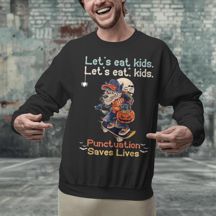 Let's Eat Kids Grammar Werewolf Halloween Teacher Unisex Sweatshirt, gift for family, gift for coworker Let's Eat Kids Grammar Werewolf Halloween Teacher Unisex Sweatshirt, gift for family, gift for coworker