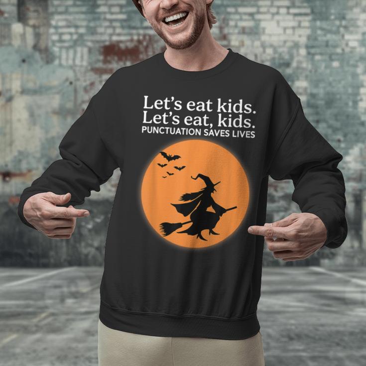 Let's Eat Kids Punctuation Saves Live Witch Grammar Teacher Unisex Sweatshirt, gift for family, gift for coworker Let's Eat Kids Punctuation Saves Live Witch Grammar Teacher Unisex Sweatshirt, gift for family, gift for coworker