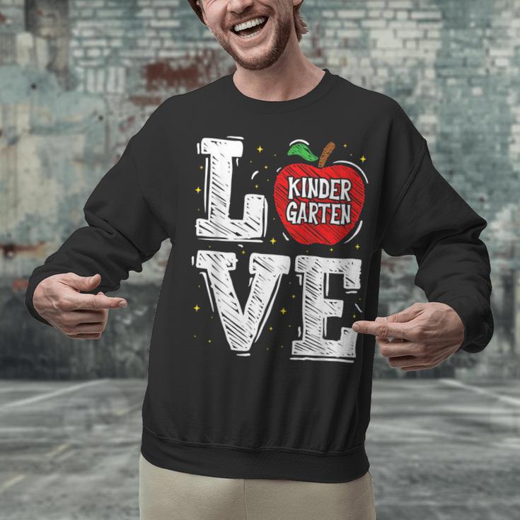 LOVE Kindergarten Teacher Student School Apple Unisex Sweatshirt, gift for family, gift for coworker LOVE Kindergarten Teacher Student School Apple Unisex Sweatshirt, gift for family, gift for coworker